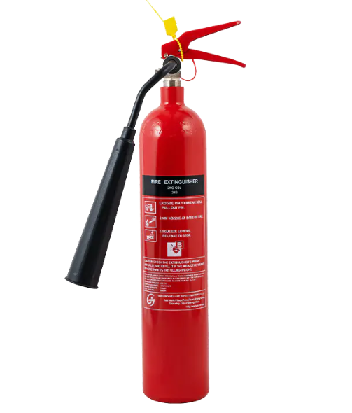What safety precautions should be taken when using a carbon steel CO₂ fire extinguisher, particularly in enclosed spaces?